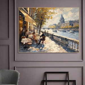 May include: A painting depicting a Parisian cafe scene with people sitting at tables on a terrace overlooking a river. The cafe is located on the banks of the Seine River, with a bridge in the distance and a church with a dome in the background. The painting is done in a realistic style with a focus on detail and light.
