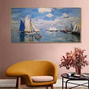 May include: A framed oil painting depicts a seascape with sailboats on the water under a blue sky with clouds. The painting features a variety of sailboats with white sails and a few with blue sails. A small boat with people is in the foreground.
