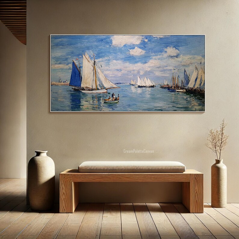 May include: A framed canvas print of a seascape featuring sailboats on the water under a blue sky with clouds. The artwork has a classic, impressionistic style. The print is displayed above a wooden bench in a room with neutral-toned walls.