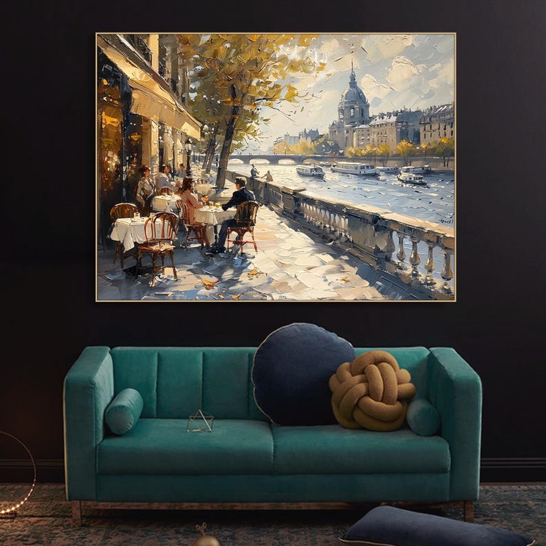 May include: A painting depicting a Parisian cafe scene, featuring people seated at tables outside. The cafe is situated on the banks of the River Seine, with a view of the city skyline in the background. The painting is executed in a loose, impressionistic style, using vibrant colours and brushstrokes.
