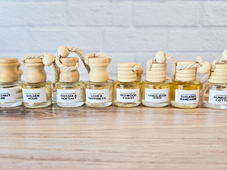 Summer and year round scented car diffusers. Fragrances include Coconut Lime, Golden Hour, Freesia & Sea Salt, Love & Happiness, Redwood Coast, Sandalwood Suede, Sugared Mandarin, and Sunkissed Cotton.