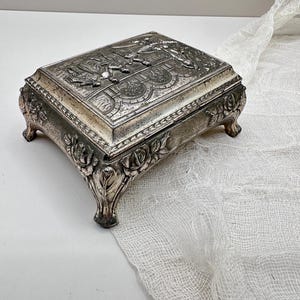 Vintage Silver-Tone Metal Jewelry Box with Raised Garden Scene • Ornate Baroque Trinket Box • Footed Keepsake Box with Burgundy Interior