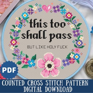 May include: Counted cross stitch pattern featuring a floral wreath with the text "this too shall pass but like holy fuck". The pattern is available as a digital download.