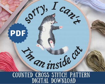 May include: A counted cross stitch pattern featuring a grey and white cat with the text "Sorry, I can't I'm an inside cat". The pattern is on a blue background and is available as a digital download.