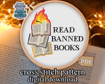 May include: A cross-stitch pattern featuring a design with three open books, one on fire, and the words "READ BANNED BOOKS." The design is set in a wooden embroidery hoop. The text "cross stitch pattern digital download" is below.
