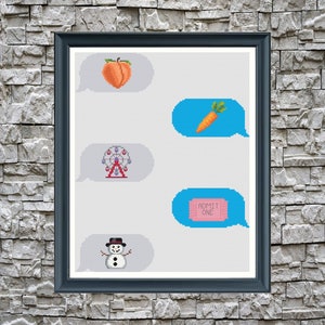 May include: A framed print with a white background and four blue speech bubbles. Each bubble contains a different pixelated image: a peach, a carrot, a Ferris wheel, and a ticket that says "ADMIT ONE".