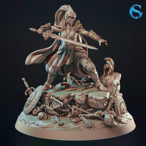 May include: A detailed figurine of a warrior in ornate armor, holding two swords, standing atop a rocky terrain with skeletal remains. The warrior wears a helmet and cape, with a shield and additional swords nearby. The figurine is a neutral color.