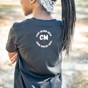 Back of Bella + Canva 3001 Girls Black T-Shirt| Black Girl Mockup| Children’s Model Mockup| T-Shirt Mockup| Black Model Mockup