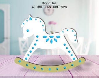 May include: A white rocking horse with blue and white geometric patterns. The horse has a yellow base with blue accents.