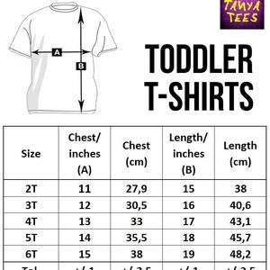 May include: Size chart for toddler t-shirts with measurements in inches and centimeters. The chart shows chest and length measurements for sizes 2T through 6T, with a tolerance of +/- 1 inch for chest and +/- 2.5 cm for length.