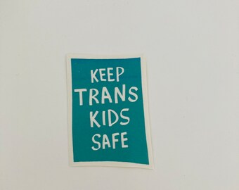 GREEN “keep trans kids safe” sticker