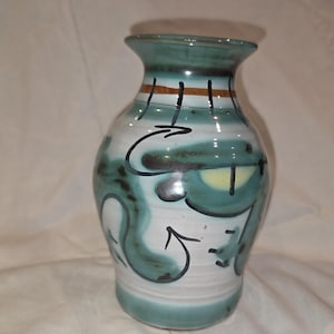 May include: A white ceramic mug with a black handle and the text "But First, Coffee" in a bold, black font. The mug is likely 4 inches tall and holds approximately 12 ounces of liquid. Perfect for enjoying your morning coffee.