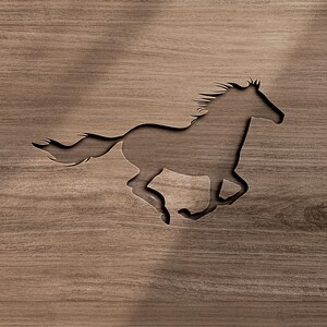 May include: A dark brown wooden panel featuring a cutout silhouette of a galloping horse. The horse is depicted in profile, facing right, with a flowing mane and tail. The wood grain is visible throughout the surface, creating a natural texture.