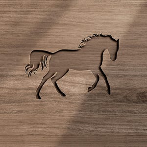 May include: A dark brown wooden panel featuring a laser-cut silhouette of a horse in motion. The cutout reveals the horse's form against the grain of the wood, showing a flowing mane and tail with a distinct, sharp outline of the animal's body.