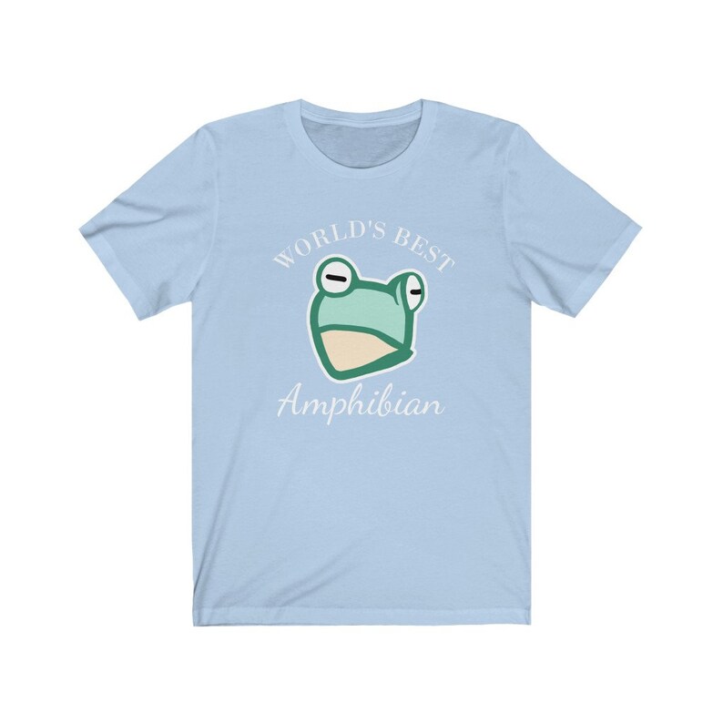 May include: Light blue t-shirt with a white graphic of a frog and the text "World's Best Amphibian".