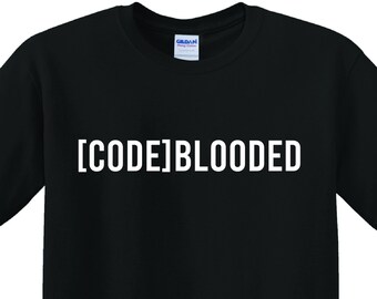 May include: Black t-shirt with the white text "[CODE]BLOODED" across the chest. The shirt is a crew neck style and appears to be made of cotton. The Gildan logo is visible on the collar.