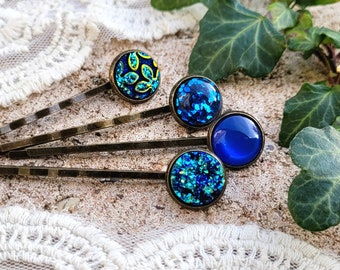 Hair clip set in shades of blue with gold and green