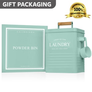 May include: A light blue metal laundry detergent container with a wooden handle and a scoop. The container has the words "Loads of Fun" and "Laundry" printed on it. The container is labeled "Calindiana Powder Bin".