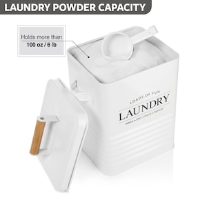 May include: White metal laundry powder container with a lid and a wooden handle. The container has a label that says "Loads of Fun Laundry Wash Dry Fold Repeat" and holds more than 100 ounces or 6 pounds of laundry powder.