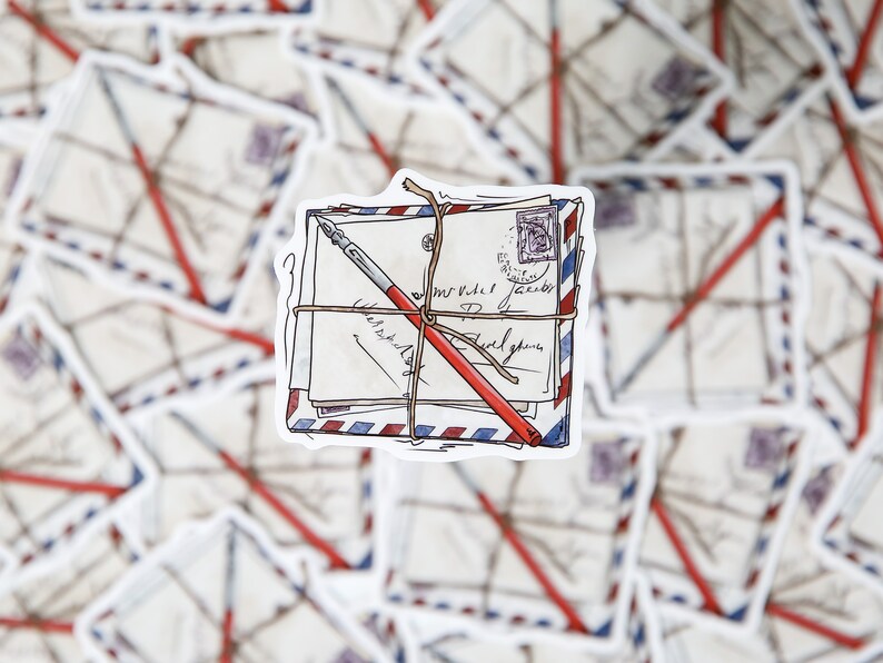 May include: A stack of vintage envelopes tied with twine and a red pen, with handwritten text on the envelopes. The envelopes have a blue and red striped pattern.