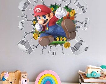 May include: A wall decal featuring Mario breaking through a cracked wall. Mario is wearing his signature red hat and blue overalls, with gold coins and green foliage in the background. The decal is designed to create a 3D effect.