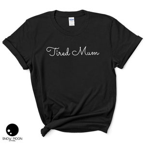 May include: Black t-shirt with white text that reads "Tired Mum".