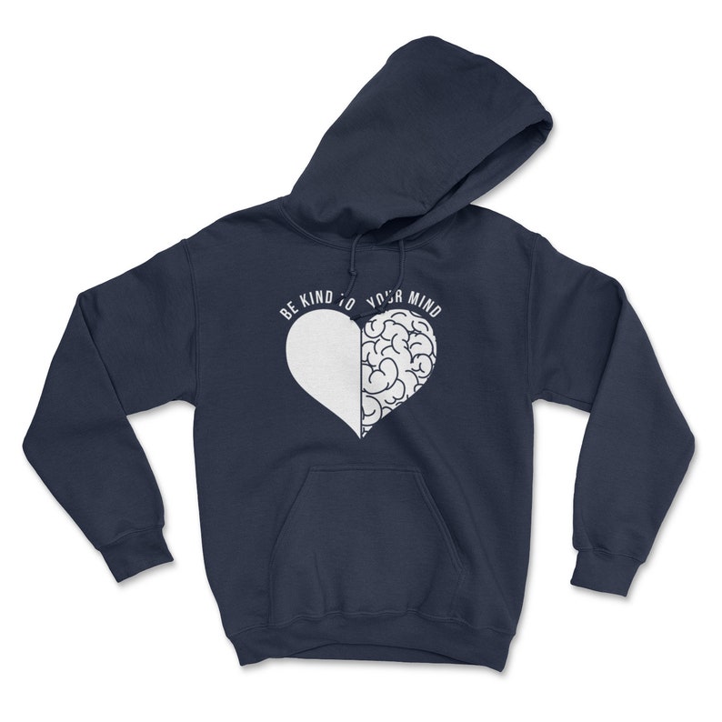 May include: Navy blue hoodie with a white heart design. The heart is split in half, with one side being a brain and the other side being blank. The text "Be kind to your mind" is written around the heart.