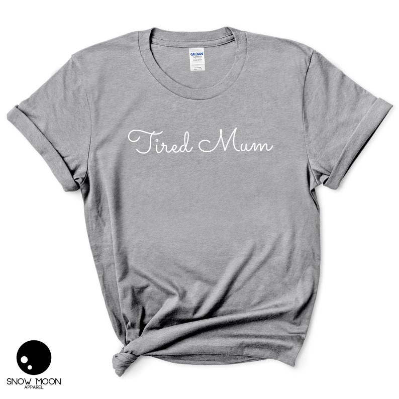 May include: Gray t-shirt with the text "Tired Mum" in white cursive writing.