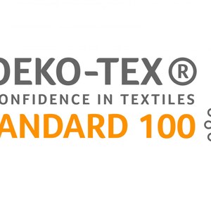 May include: A gray and orange logo with the text "OEKO-TEX&reg; CONFIDENCE IN TEXTILES STANDARD 100". A stylized gray circle with a globe inside is to the right of the text.