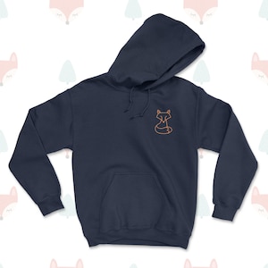 May include: A navy blue hoodie with a small orange fox outline on the front.