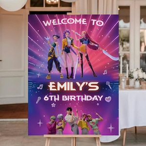 May include: A purple and pink birthday party sign with the text "Welcome to" and "Emily's 6th Birthday". The sign features illustrations of three animated characters and a group of people at the bottom.