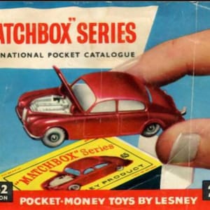 May include: A vintage Matchbox Series catalogue cover, showcasing a red toy car with an open bonnet. The cover displays the text "MATCHBOX SERIES" and "INTERNATIONAL POCKET CATALOGUE". A small box with a car image is also visible.