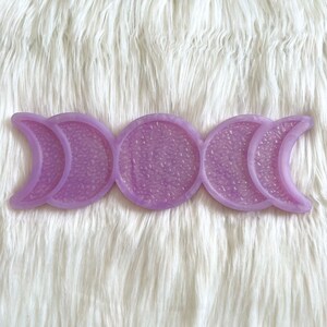 May include: A purple triple moon resin tray with a textured surface.