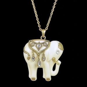 Unique Vintage NRT White Elephant Pendant Necklace with gold color 17 inch chain, dangling rhinestones