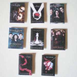 May include: A collection of 10 book covers for the Twilight Saga by Stephenie Meyer. The covers feature different characters and scenes from the books, including Bella Swan, Edward Cullen, Jacob Black, and the Volturi. The books are titled "Twilight", "New Moon", "Eclipse", "Breaking Dawn", and "The Twilight Saga: Breaking Dawn".