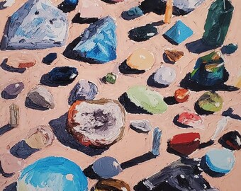 May include: A painting depicting a collection of colourful crystals and stones on a pink background. The painting is titled "Crystal Collection 2" and signed by the artist, "Aylin Enriquez, 2022".