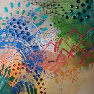 May include: Abstract painting with a mix of blue, green, orange, and yellow paint. The painting is decorated with blue, green, and orange rhinestones.