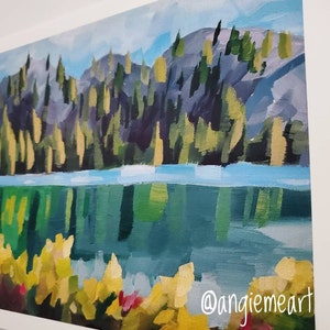 May include: A painting depicting a lake with a forest in the background. The lake is a vibrant blue-green colour and the forest is a dark green with touches of yellow. The painting is executed in a loose, impressionistic style.