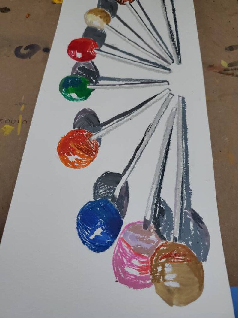 May include: A painting of a fan of colorful lollipops with gray sticks on a white background.
