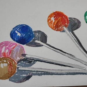 May include: A watercolor painting of six lollipops with different colored candy heads and white sticks. The lollipops are arranged in a fan shape with the candy heads facing the viewer. The colors of the candy heads are blue, pink, brown, orange, green, and gray.