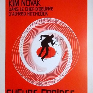 May include: A red and white poster for the film "Vertigo" (Sueurs Froides) starring James Stewart and Kim Novak. The poster features a stylized image of a man falling into a spiral.