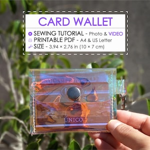 May include: A clear, iridescent card wallet with a snap closure is held in a hand. The wallet contains cards and has the word "UNICO" printed on it. Text above the wallet reads "CARD WALLET" and details a sewing tutorial.
