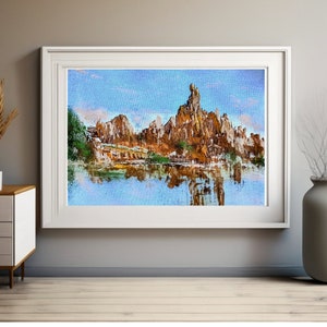 May include: A painting depicting a mountain range reflected in a tranquil lake. The mountains are a blend of brown and grey, with some green trees dotted around. The sky is a pale blue with a few white clouds.