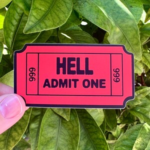 May include: Red ticket with black text that reads "HELL ADMIT ONE" and the numbers "666" on either side.