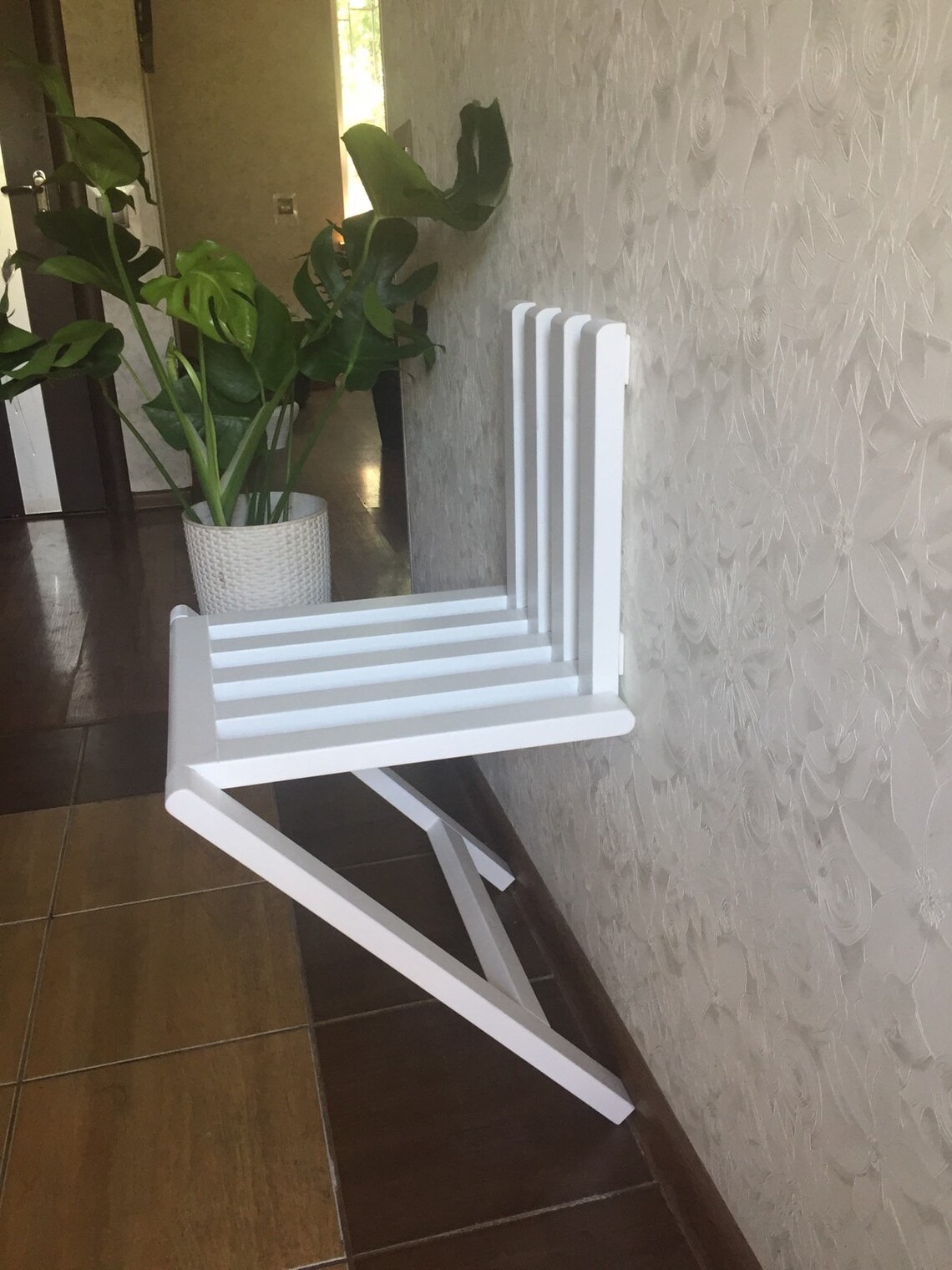 Wall mounted folding chair in the hallway nursery kitchen. Etsy