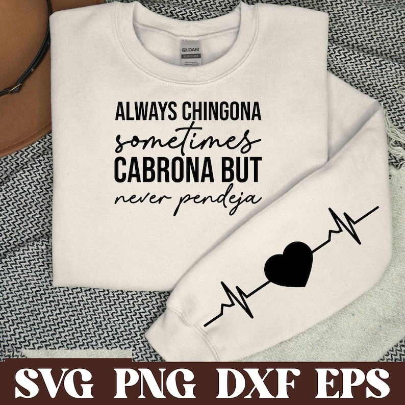 May include: White sweatshirt with black text that reads "ALWAYS CHINGONA sometimes CABRONA BUT never pendeja" and a black heart with a heartbeat line on the sleeve.