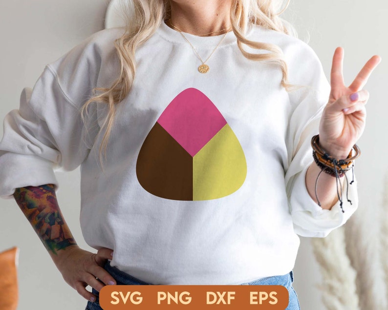 May include: A white sweatshirt with a brown, pink, and yellow geometric design in the shape of a triangle.