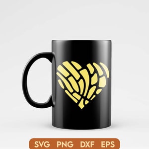 May include: A black coffee mug with a yellow heart-shaped design. The heart is made up of a pattern of lines and curves.