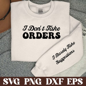 May include: White sweatshirt with black text that reads "I Don't Take Orders" on the front and "I Barely Take Suggestions" on the sleeve.