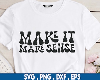 May include: White t-shirt with black text that reads "Make it make sense" in a retro font style.